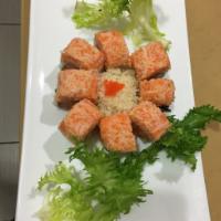Dynamite Roll · Spicy crunch salmon inside with spicy crab on top.