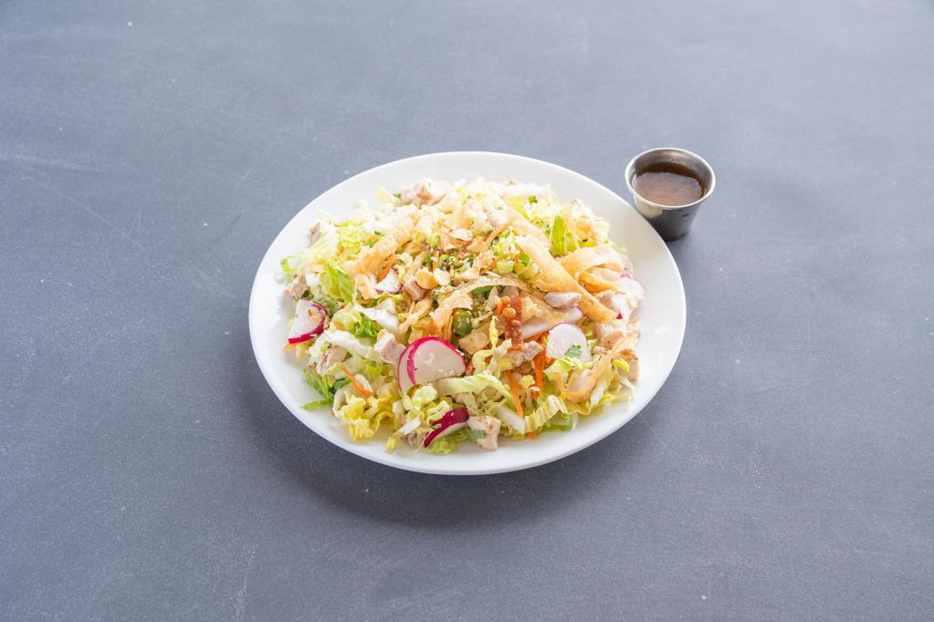 Chinese Chicken Salad · Grilled chicken breast, Napa cabbage, little gem lettuce, sesame seeds, green onions, cilantro, radishes, toasted almonds, crispy won tons and ginger-sesame vinaigrette.