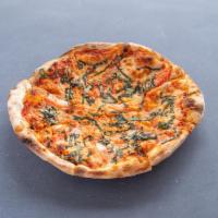 Margherita Pizza · Housemade mozzarella, fresh basil, tomato sauce