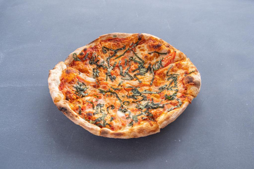 Margherita Pizza · Housemade mozzarella, fresh basil, tomato sauce