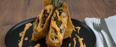 Midwest Rolls · Gardein chicken, red peppers, black beans, corn, onions, and cilantro, wrapped and fried in tortilla shells. 2 per order. Served with fries.