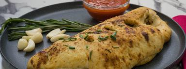 The 612 · Stromboli inspired stuffed roll filled with mushrooms, onions, mozzarella cheese, and field ...