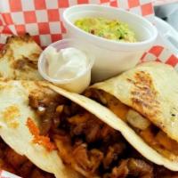 Quesadillas · Served with fresh homemade chuncky red salsa and sour cream.