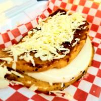 Cachapas · Sweet corn pancakes. Served with queso de mano and topped with queso llanero.
