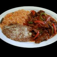 Ranchero Steak · Beef, onion, tomato, jalapeno slices served with rice, beans, tortillas.