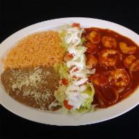 Shrimp Devil Style · Seasoned shrimp with extra spicy homemade sauce, served with rice, beans, salad and tortilla...