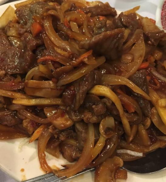 Mongolian Beef · Sliced tender beef seared with onions, scallions in special mongolian sauce. Spicy.