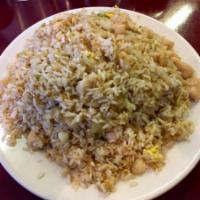 Chicken Fried Rice · Prepared steamed white rice with soy sauce, eggs, peas, carrots and green onions.