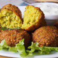 Falafel · Fried chickpeas, tzatziki sauce, cucumbers, served with bread