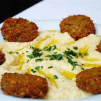 Hummus and Falafel Plate · Hummus plate, chickpeas falafels, side of spicy sambal sauce, tzatziki sauce, 2 sides of bre...