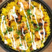 Shish Tawook · Traditional marinated grilled chicken, grilled onions, large plate of biryani rice (green be...