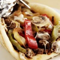 Deluxe Pita Cheeseburger · Large size only. Halal ground beef sandwich, mixed cheese, grilled onions, peppers topped wi...