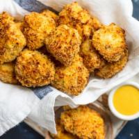 Hand-breaded Chicken Tender · Fried & backed hand-breaded crispy parmesan chicken breast bites, BBQ sauce and ranch on the...