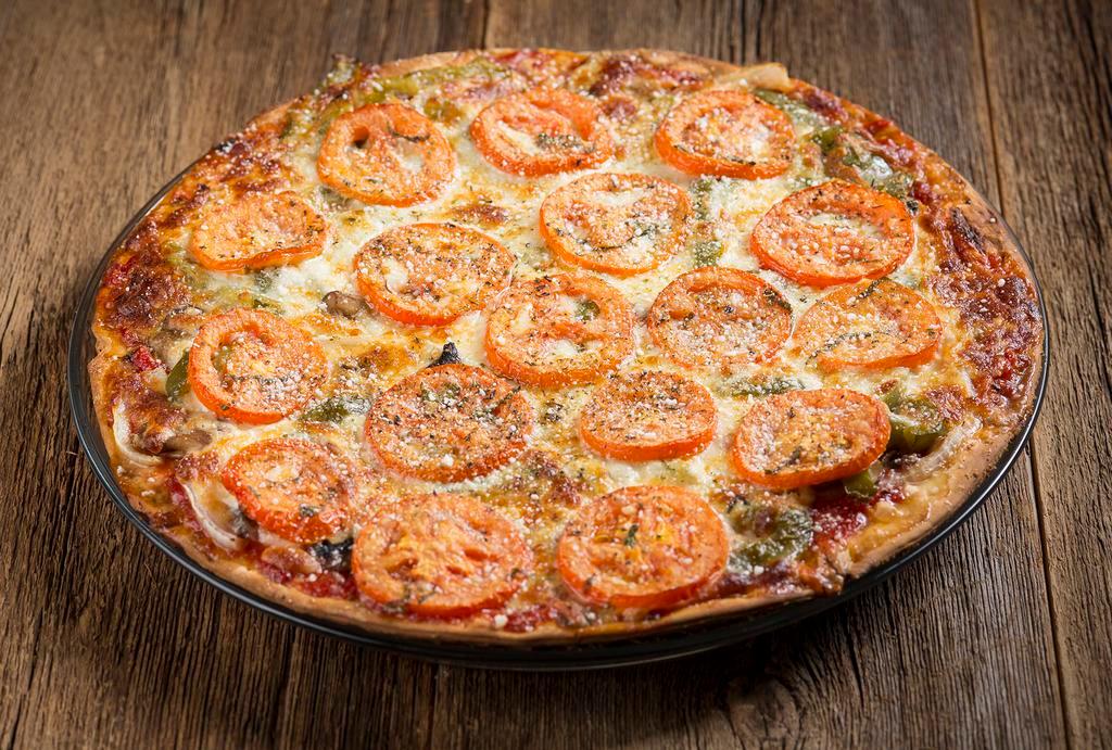 The Veggie Pizza · Mushroom, onion and green pepper with tomato on top. Vegetarian.