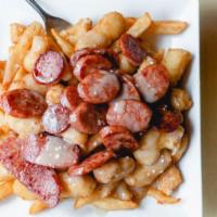 Acadia Poutine · Fries, cheese curds, gravy, and andouille sausage. Add bacon and jalapenos for an additional...