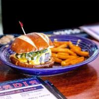 Pretzel Burger · 6 oz. beef patty, cheese sauce, grilled jalapenos on a toasted pretzel bun. Side of fries an...