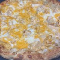 Buffet Buffalo Pizza · Bleu cheese dressing and hot sauce, roasted chicken, cheddar cheese, and mozzarella.