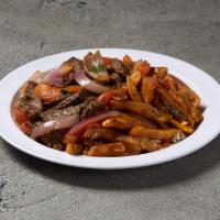 Lomo Saltado · Beef stir fry sauteed onions, tomatoes over French fries and a side of white rice.