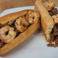 Shrimp CheeseSteak Sub · Fresh sub roll overstuffed with Grilled Shrimp, steak meat, your choice of cheese and toppin...