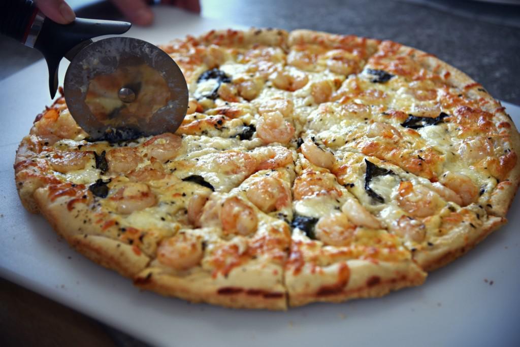 SHRIMP ALFREDO PIZZA · Shrimp, spinach And tomatoes . Alfredo sauce with extra cheese