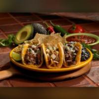 Mexico City Taco · Three tacos with your choice of protein, onions, cilantro and cheese. Served with rice and b...