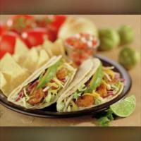 Baja Tacos · Two tacos filled with grilled fish or shrimp and crisp cabbage, baja sauce, avocado and jack...