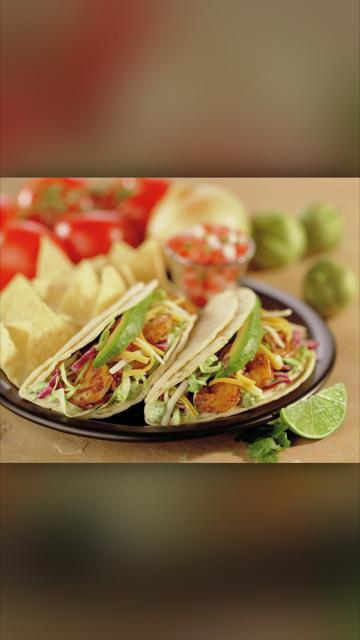 Baja Tacos · Two tacos filled with grilled fish or shrimp and crisp cabbage, baja sauce, avocado and jack and cheddar cheeses.