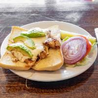 Blackened Chicken Sandwich · A tender grilled chicken breast rubbed with house Cajun mix and topped with mozzarella chees...