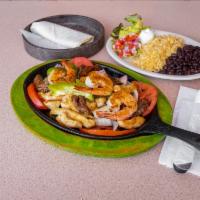 Fajitas For 2 · Served on a sizzling plated with grilled peppers and onions with a side of guacamole, sour c...