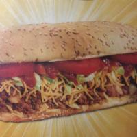 Beef Taco Burger Sub · Taco seasoned burger, cheddar cheese, taco chips, onions, lettuce and tomatoes topped with s...
