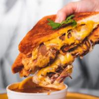 Birria Cheese Melt and Consomme Soup · 18-hour smoked brisket, Havarti, Muenster, and Cheddar cheese, homemade thick-sliced Japanes...