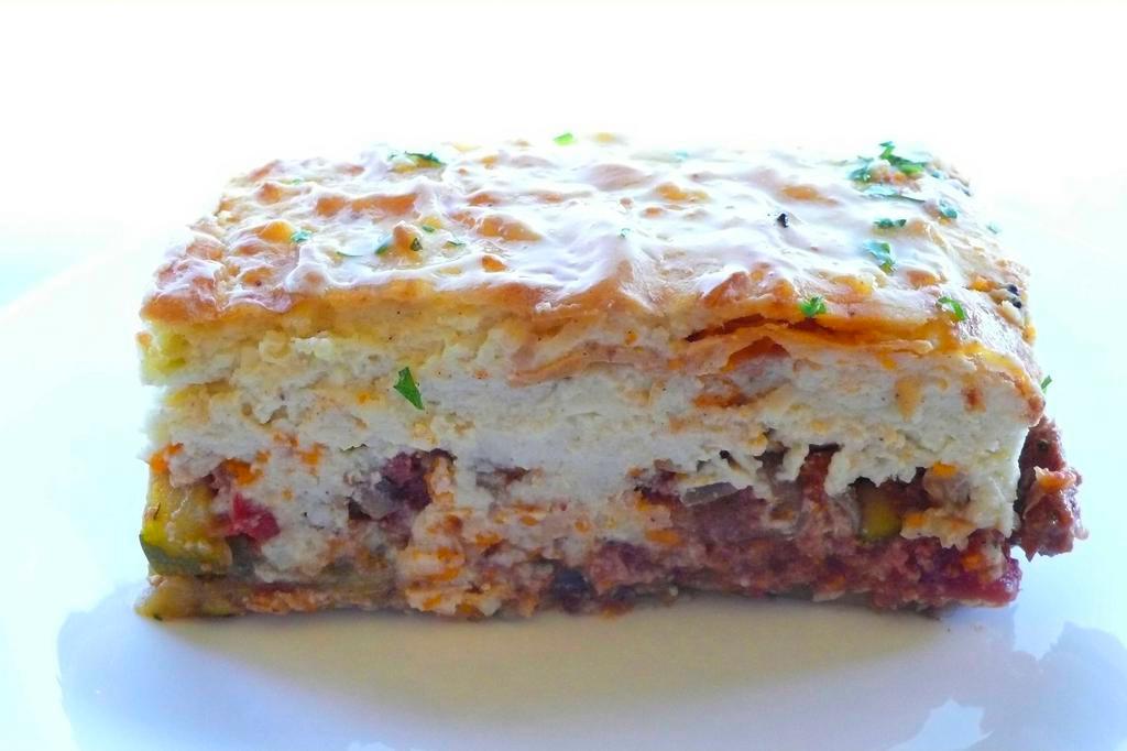 New! Moussaka · Traditional Greek dish! Eggplant, tomato, onions, cinnamon and savory spices baked with béchamel on top. Available with Lamb or Vegetarian. Includes Hummos, Pita Bread and choice of side.