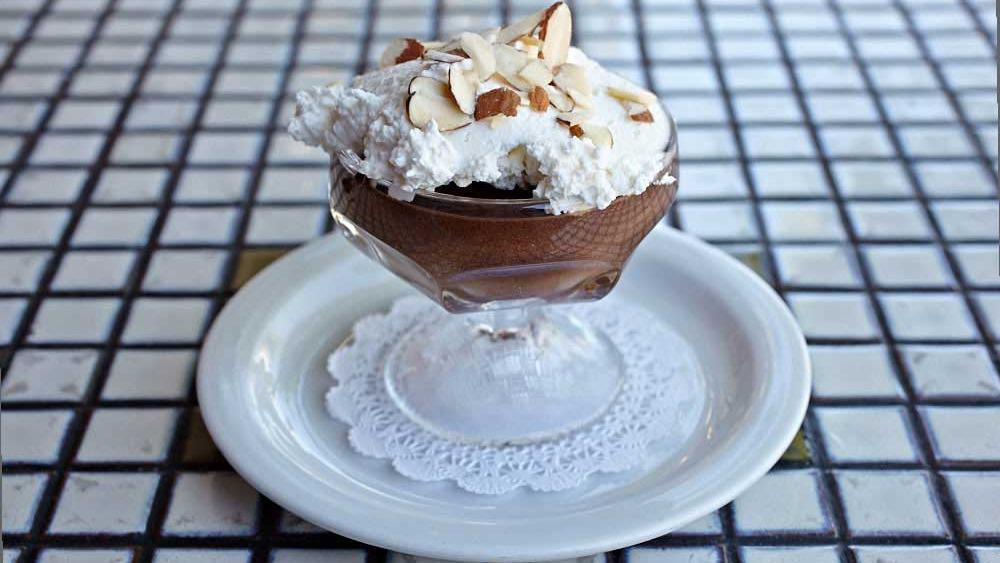 Chocolate Mousse · Chocolate Mousse with whipped cream & toasted almonds