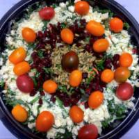 Winter Kale Salad · Kale salad with feta cheese, cherry tomatoes, sunflower seeds, dried cranberries and balsami...