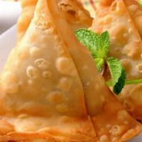 Vegetable Samosa  · Crispy pastry stuffed with potatoes, peas and seasoned with spices.