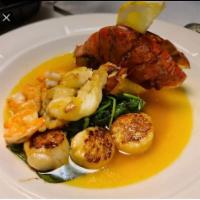 King Of The Sea · Lobster, shrimp, scallops in a lemon butter sauce. Served with steamed rice. Served with gre...