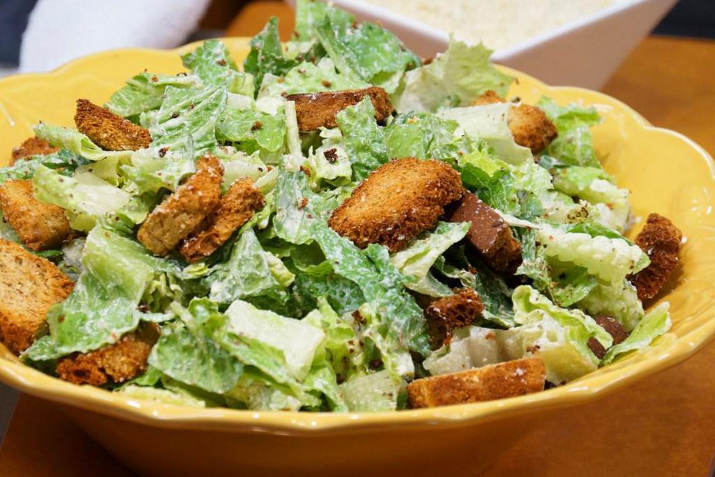 Caesar Salad · Hearts of romaine tossed in Caesar dressing and topped with Parmesan cheese, and croutons. Extra dressing and add toppings for an additional charge.