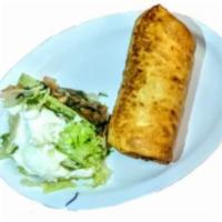 Chimichanga  · Meat of your choice with beans, rice pico de gallo served with  a salad carne de su gusto co...