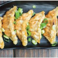 6 Pieces Gyoza · Beef or vegetable.