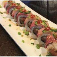 8 Piece Yellow Tail Delight Roll · Inside: Spicy tuna, cucumber and cilantro. Topped with yellowtail, jalapeno, Sriracha and se...