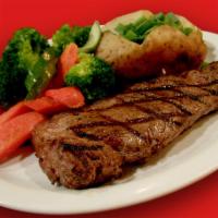 14 oz. New York Steak · Served with sauteed mushrooms.