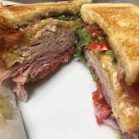 Club Sandwiches · 3 Slices of Potato Toast, Mayo, Homemade Wild Berry Glaze, Lettuce, Ham, Turkey, Lettuce, To...