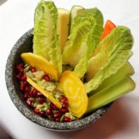 Guacamole with Crudites · Freshly made Gucamole topped with Pumpkin seeds and served with Crudites 
