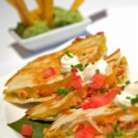 Lobster Quesadillas · Lobster and avocado Quesadillas topped with chipotle crème fraiche  