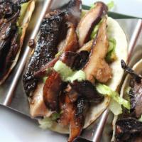 3 Piece Wild Mushroom Tacos · Assorted wild mushrooms, shallots, romaine lettuce and crema de pasilla chili sauce. Served ...