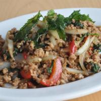 Pad Kra Prow · Grapao. Thai chili, red-green pepper, onions and basil leaf. Hot and spicy.