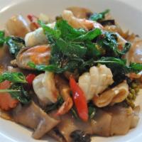 Drunken Noodles · Flat noodle, bamboo shoot, onions, tomato, pepper, carrot, string bean and basil leaf. Hot a...