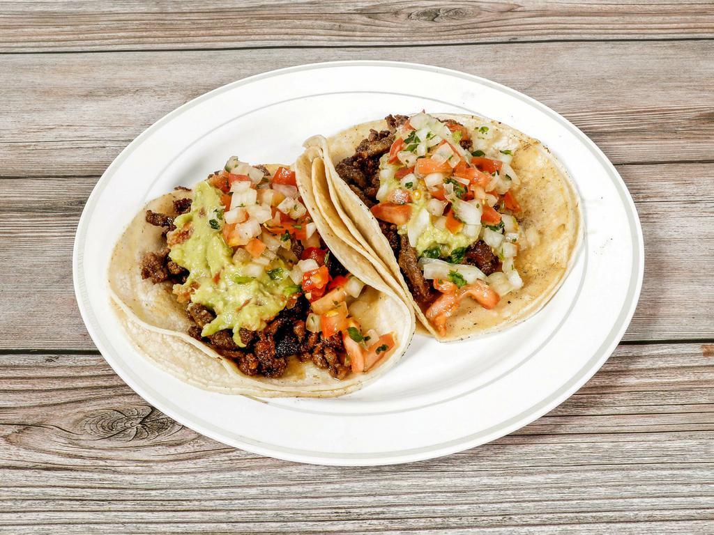 #8. Two Carne Asada Tacos Combo · Choice of meat steak, Carnitas, Alpastor or grilled chicken 