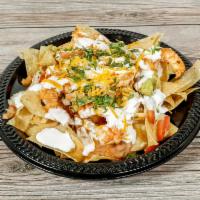 Shrimp Nachos  · Jumbo shrimp grilled loaded with beans and guacamole sour cream and pico de Gallo melted che...