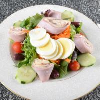 Chef Salad · Ham, turkey, roast beef, Swiss cheese and hard boiled egg on top of mixed greens.
